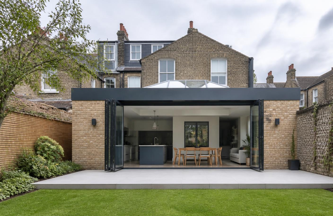 Single-storey rear extension with bifold doors and a roof lantern on a London brick house
